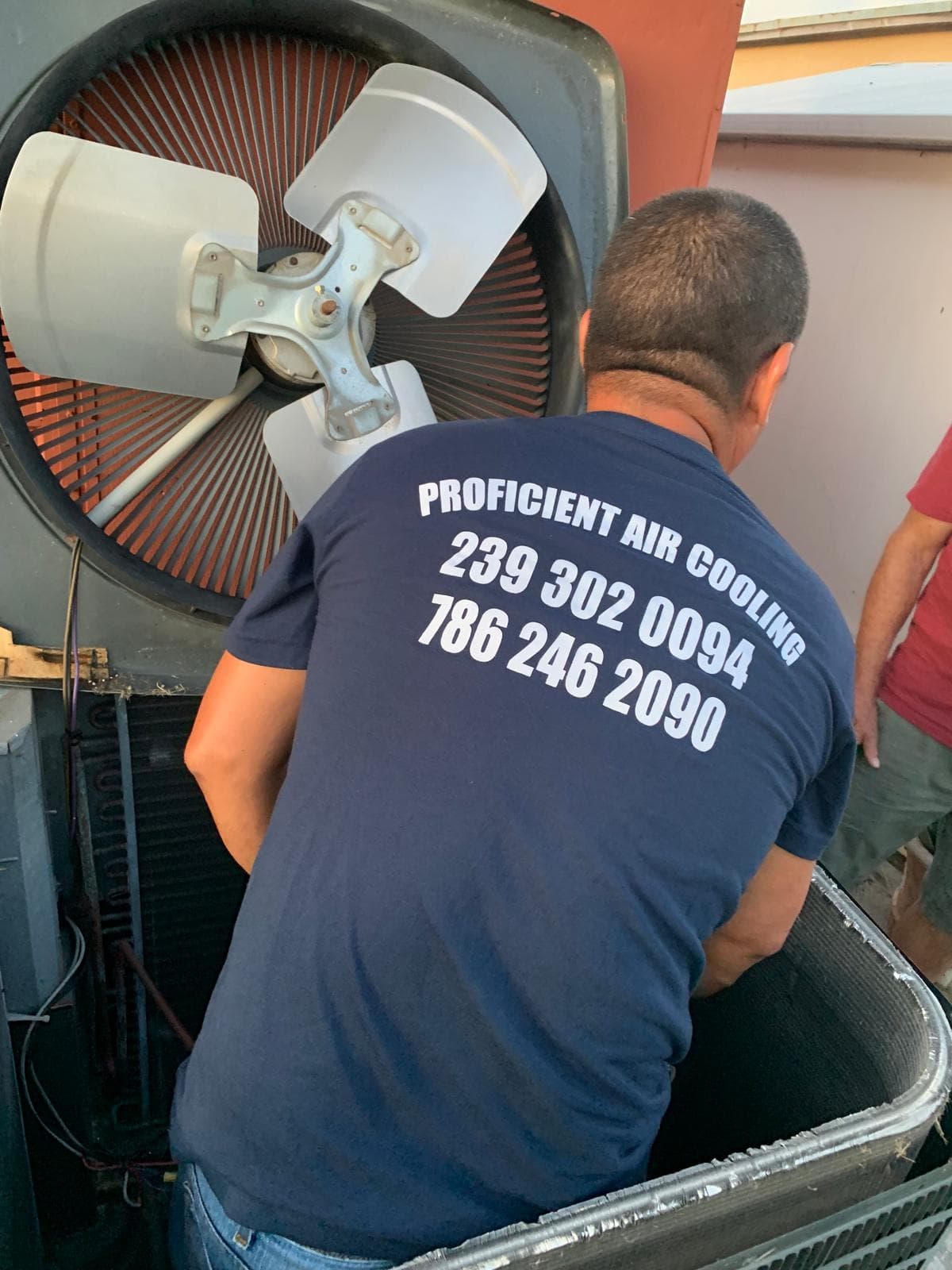Technician servicing an outdoor AC unit